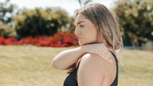 Woman with pain benefits from LED light therapy.
